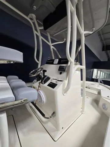 Slide: The Image of 2025 Avenger Boats AV26 console with modern steering and seating. - 6