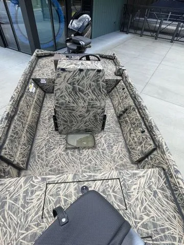 Slide: The Image of 2023 Crestliner 1860 Retriever CC boat with camouflage interior design. - 7