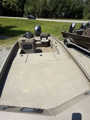 Slide: The Image of 2023 G3 Gator Tough 17 SC boat, beige deck, parked outdoors. - 4