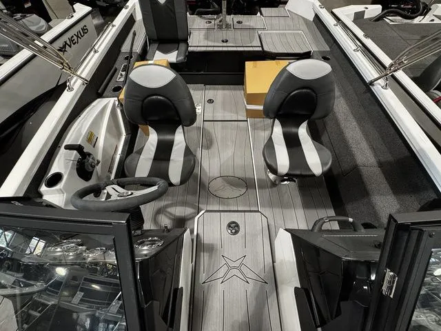 Slide: The Image of 2024 Vexus ADX190 boat interior with dual seats and sleek design. - 11