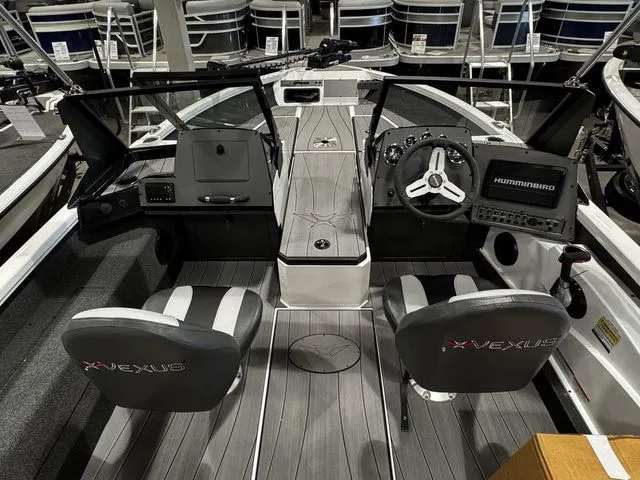 Slide: The Image of 2024 Vexus ADX190 boat interior with steering wheel and seating, featuring modern design and controls. - 4