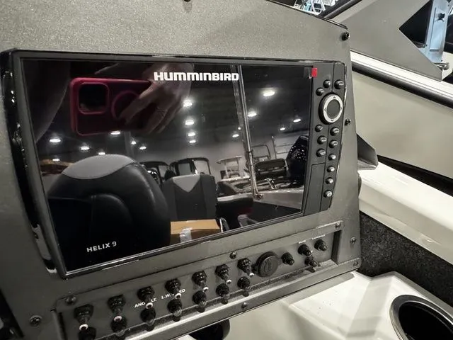 Slide: The Image of 2024 Vexus ADX190 boat dashboard featuring a Humminbird Helix 9 fish finder. - 7