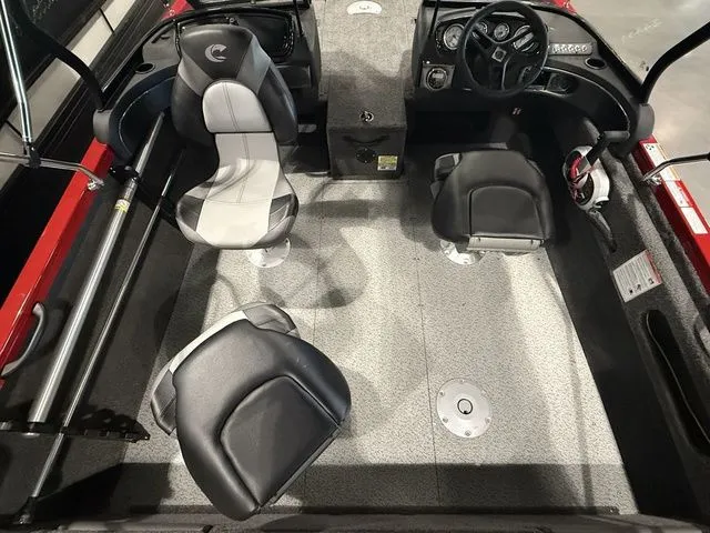 Slide: The Image of 2025 Crestliner 1750 Hawk boat interior with modern seating and steering console. - 5