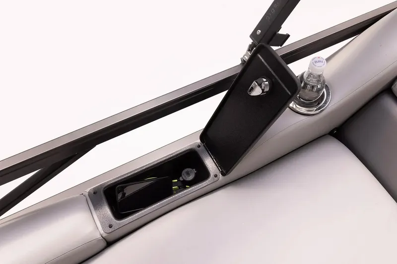 Slide: The Image of 2024 SunCatcher Select 322SS boat console with storage compartment and cup holder. - 3