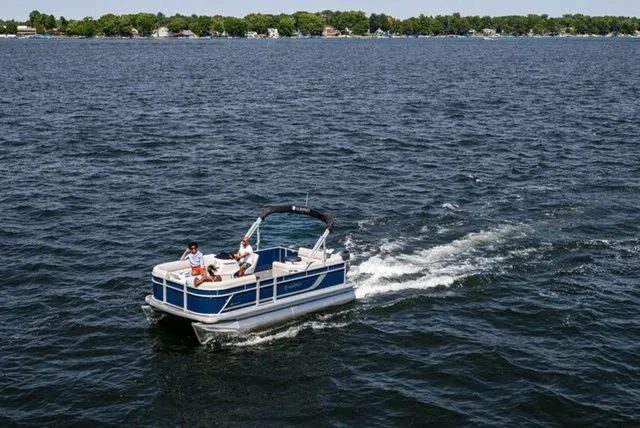 Slide: The Image of 2025 Godfrey Xperience 1886 CX pontoon boat in showroom, front view. - 1