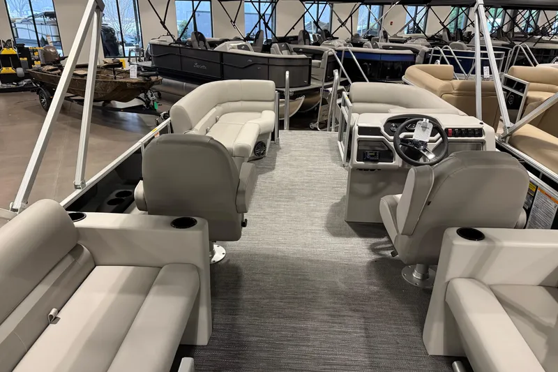 Slide: The Image of 2025 Godfrey Xperience 2086 SBX pontoon boat interior with plush seating and modern helm. - 2