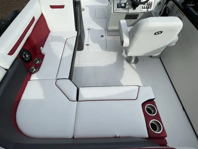 Slide: The Image of 2023 Hurricane FunDeck 1960 REF OB boat interior with white and red seating, cup holders, and steering console. - 4