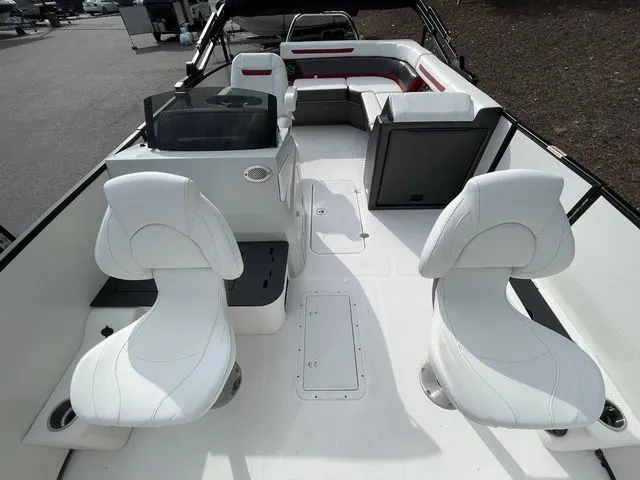 Slide: The Image of 2023 Hurricane FunDeck 1960 REF OB boat interior with white seating and helm. - 7