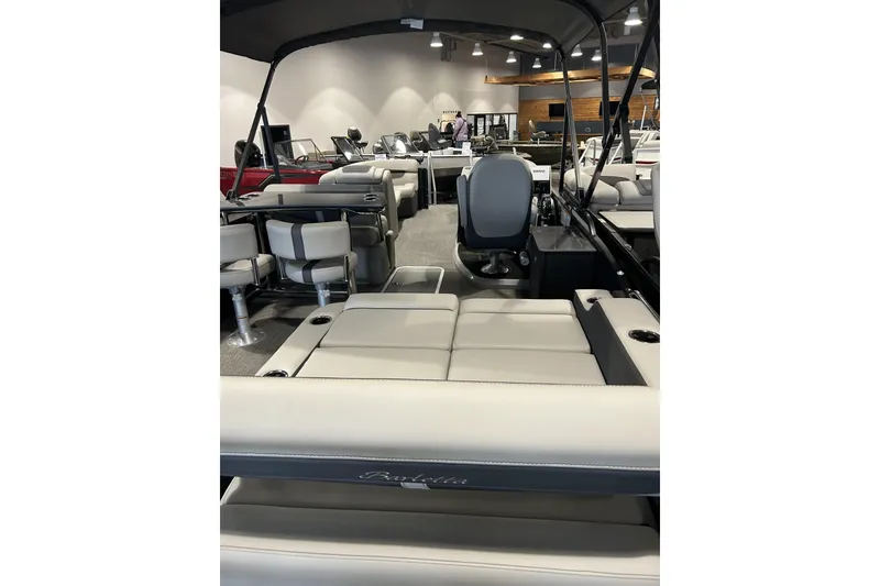 Slide: The Image of 2025 Barletta C24UE pontoon boat interior with luxurious seating and modern design. - 10