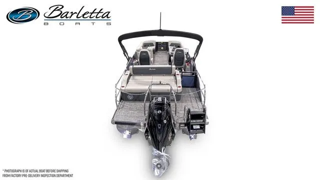 Slide: The Image of 2026 Barletta Cabrio 24UC boat, rear view, showcasing seating and motor, with American flag. - 6