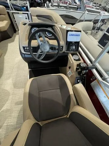 Slide: The Image of 2023 Barletta Boats C20QC helm with steering wheel and Lowrance display. - 13