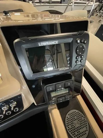 Slide: The Image of 2023 Barletta Boats C20QC dashboard with Lowrance HDS display and controls. - 14