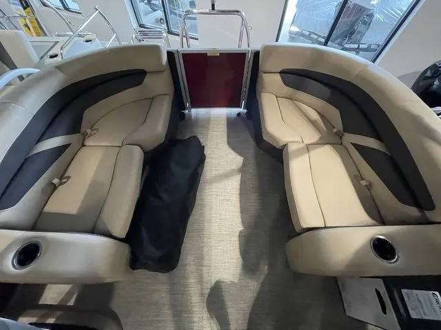 Slide: The Image of 2023 Barletta Boats C20QC interior with beige seating and cup holders. - 8