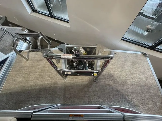 Slide: The Image of 2023 Barletta Boats C20QC pontoon deck with stainless steel railing and carpeted flooring. - 9