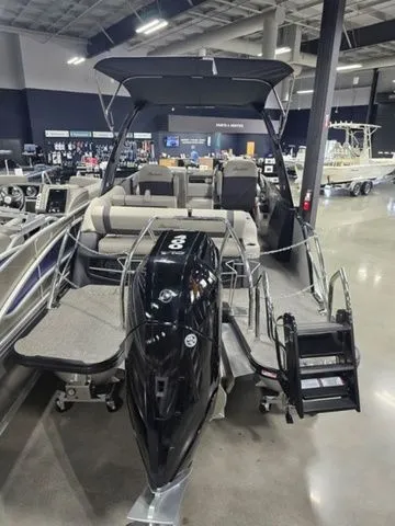 Slide: The Image of 2025 Barletta Boats R23UCA pontoon boat displayed in a showroom. - 3