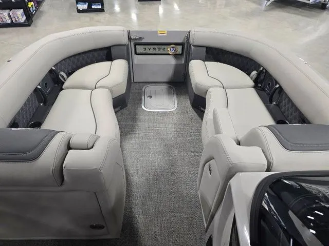 Slide: The Image of Luxurious seating area of 2025 Barletta Boats R23UCA with plush upholstery. - 8