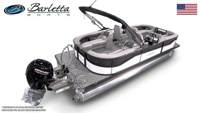 Slide: The Image of 2026 Barletta Aria 22QC pontoon boat with Mercury engine, sleek design, and American flag. - 4