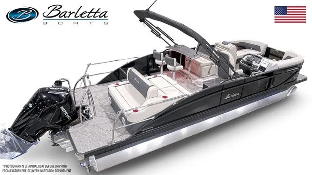 The Image of 2026 Barletta Boats C24UE pontoon with sleek design and modern features, displayed with American flag. - 1