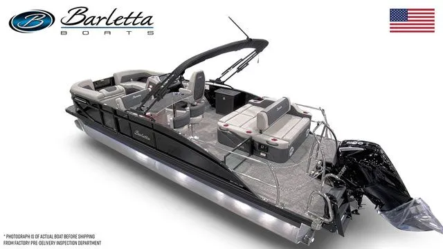 Slide: The Image of 2026 Barletta Boats C24UE pontoon with sleek design and modern features, displayed with American flag. - 3
