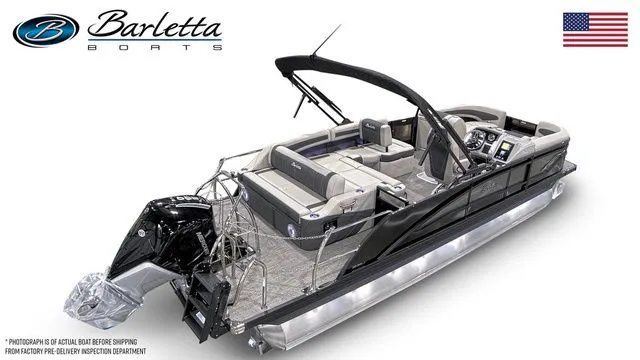 Slide: The Image of 2026 Barletta Boats 23U pontoon with sleek design and modern features, displayed with American flag. - 3
