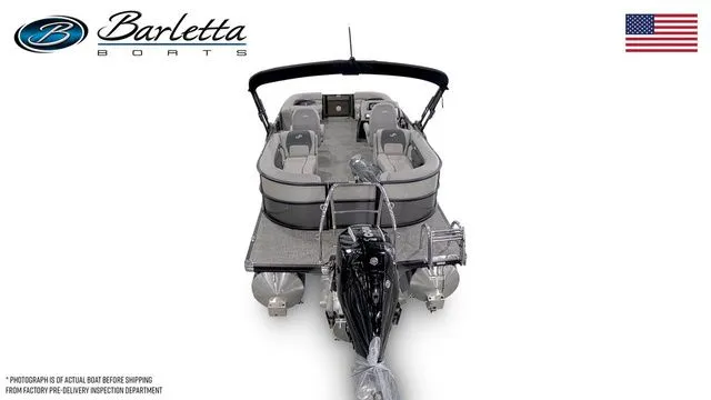 Slide: The Image of 2026 Barletta Aria 22QC pontoon boat, rear view, with seating and motor, USA flag. - 5