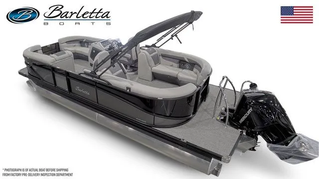 Slide: The Image of 2025 Barletta Boats C22QC pontoon with sleek design and modern features, displayed with American flag. - 3