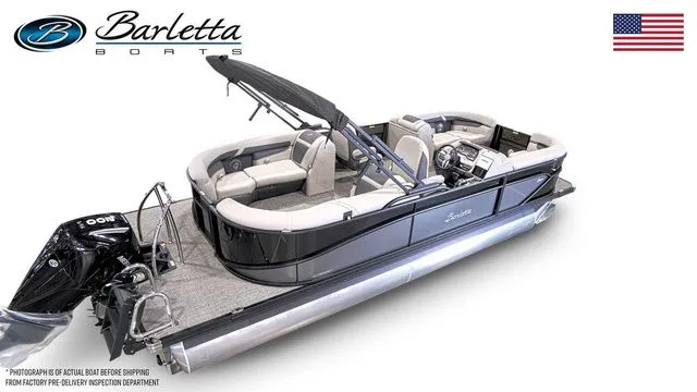 Slide: The Image of 2025 Barletta Boats C22QC pontoon with sleek design and modern features, displayed with American flag. - 4