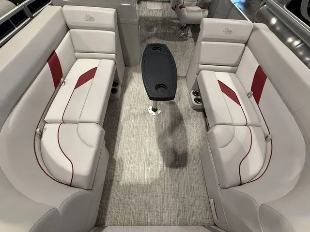 Slide: The Image of 2023 SunCatcher Select 20RC boat interior with plush seating and central table. - 3