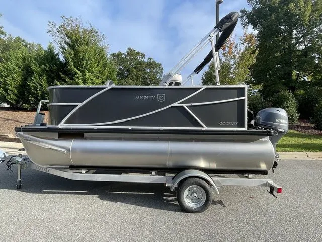 The Image of 2024 Godfrey Pontoons Mighty G 1476 F on trailer, parked outdoors. - 1