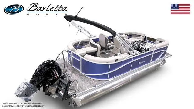 Slide: The Image of 2025 Barletta Boats C20QC pontoon with sleek design and modern features, displayed with American flag. - 4