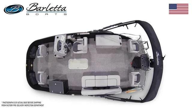 Slide: The Image of Top view of 2025 Barletta Boats A22F pontoon with seating and helm, American flag displayed. - 7