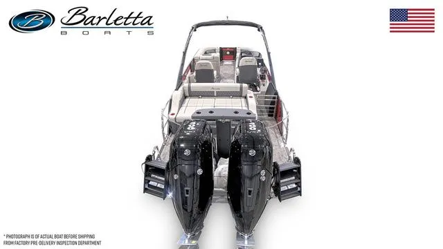 Slide: The Image of 2025 Barletta Twin L25UCAT boat with dual engines, rear view, American flag displayed. - 3