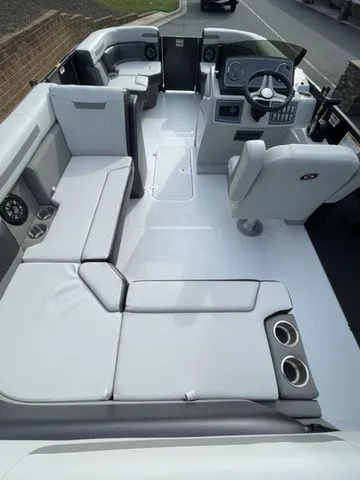 Slide: The Image of 2024 Hurricane FunDeck 1960 RE OB boat interior with spacious seating and modern helm. - 3