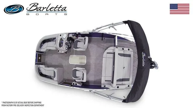 Slide: The Image of Top view of 2025 Barletta A22UC boat with seating and canopy, American flag displayed. - 7