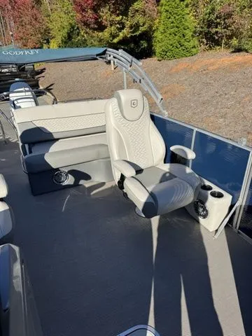 Slide: The Image of 2022 Godfrey Pontoons Monaco 235 interior with luxurious seating and cup holders. - 11