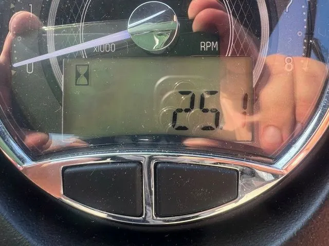 Slide: The Image of Close-up of a 2023 Barletta Boats C20Q RPM gauge displaying 25. - 6