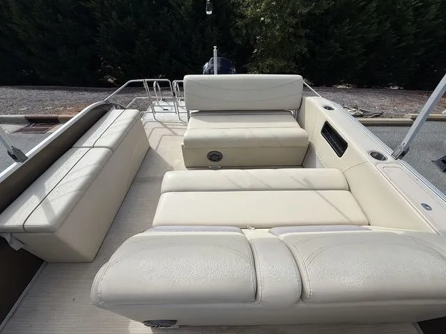 Slide: The Image of 2017 Sylvan 8524 DLZ LE pontoon boat with beige seating and spacious deck layout. - 11