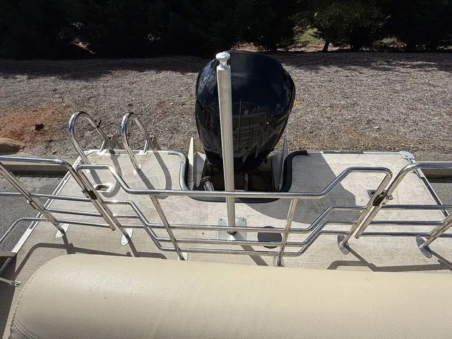 Slide: The Image of 2017 Sylvan 8524 DLZ LE pontoon boat with outboard motor and railing. - 12