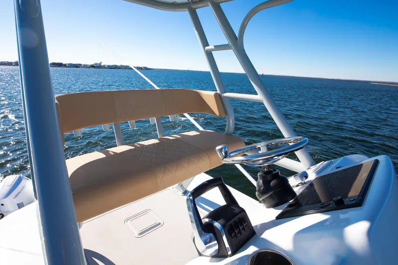 Slide: The Image of 2025 Freeman 43 Center Console boat steering area with ocean view. - 15