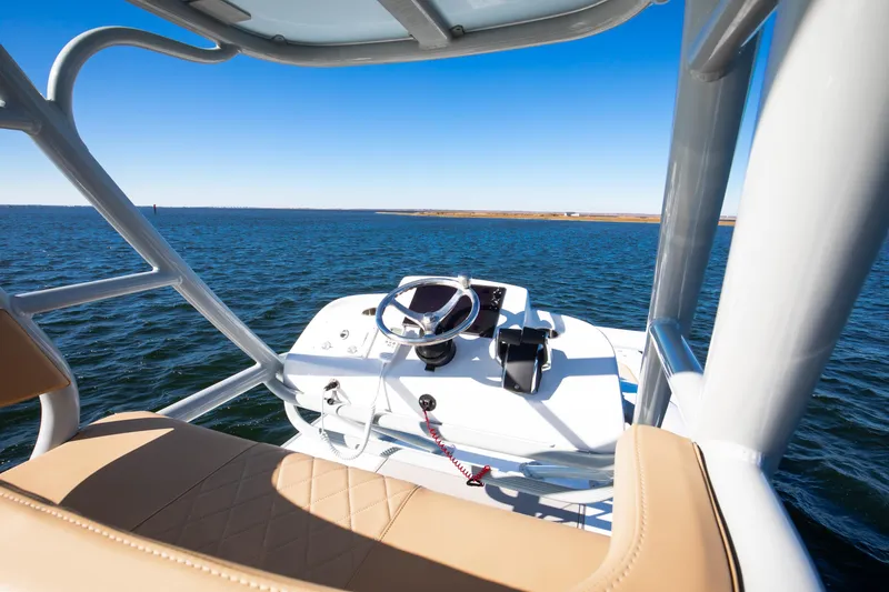 Slide: The Image of 2025 Freeman 43 Center Console boat helm with ocean view and clear blue sky. - 16