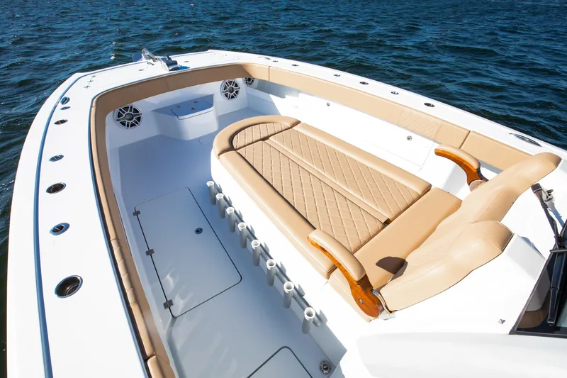 Slide: The Image of 2025 Freeman 43 Center Console boat with luxurious seating on open water. - 18