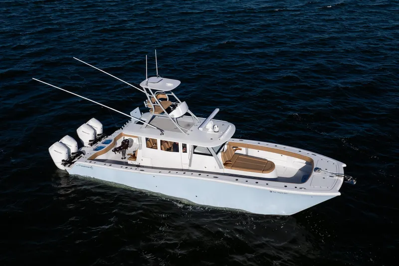 Slide: The Image of 2025 Freeman 43 Center Console boat cruising on open water. - 21