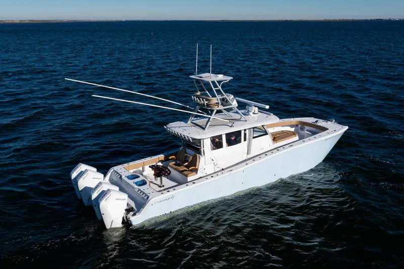 Slide: The Image of 2025 Freeman 43 Center Console boat cruising on open water. - 22