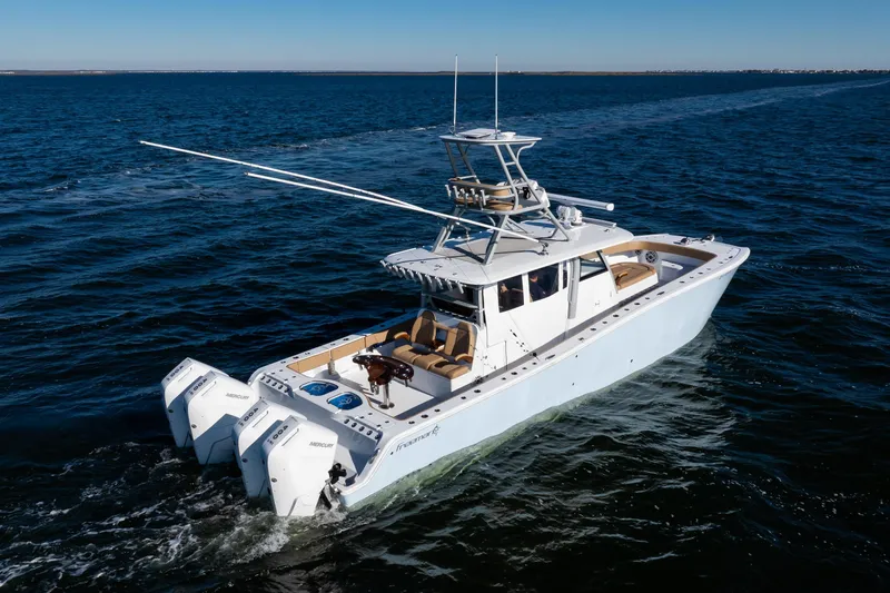 Slide: The Image of 2025 Freeman 43 Center Console boat cruising on open water. - 28
