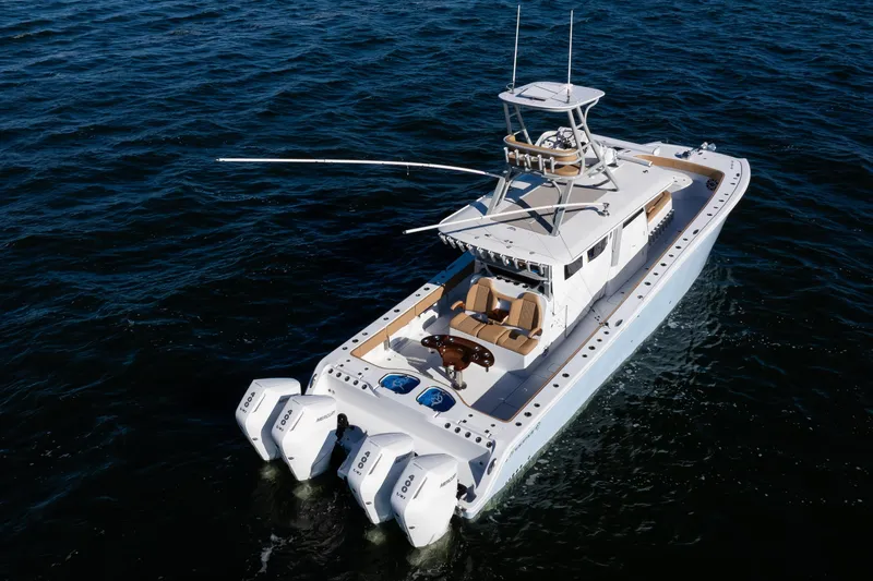 Slide: The Image of 2025 Freeman 43 Center Console boat on open water, featuring multiple outboard engines. - 29