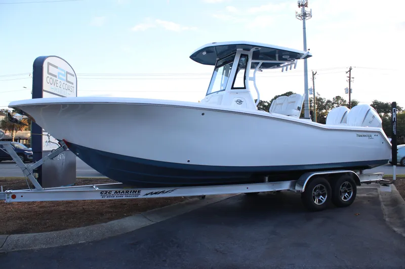 Slide: The Image of 2026 Tidewater 272 CC Adventure boat on trailer at Cove 2 Coast Marine. - 17