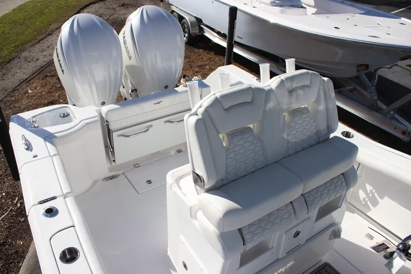 Slide: The Image of 2026 Tidewater 272 CC Adventure boat with dual engines and luxurious seating. - 5