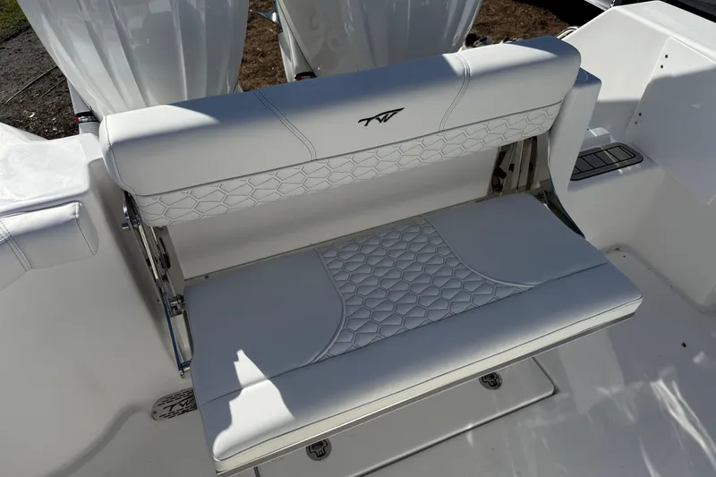 Slide: The Image of 2026 Tidewater 272 CC Adventure boat seat with white upholstery and stylish design. - 8