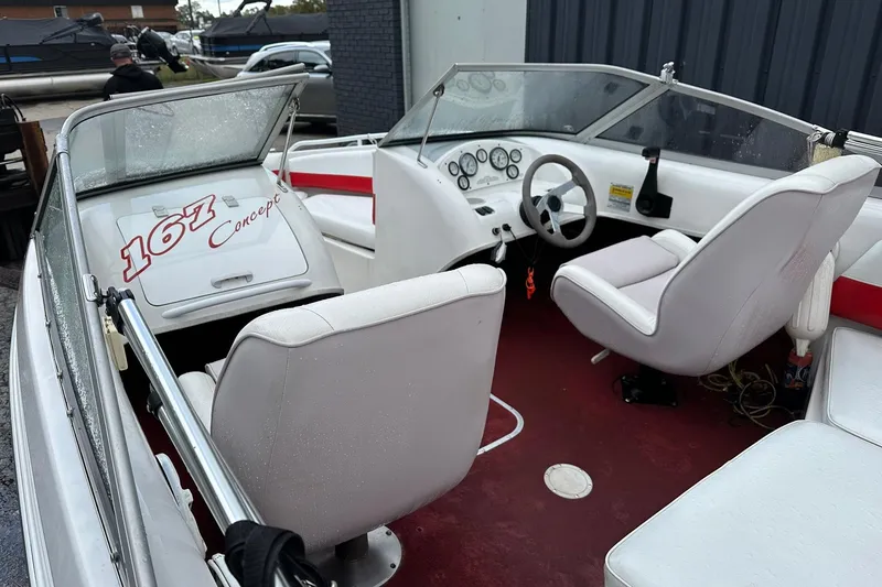 Slide: The Image of 1991 Chris-Craft 167 Concept boat interior with white seats and red accents. - 6