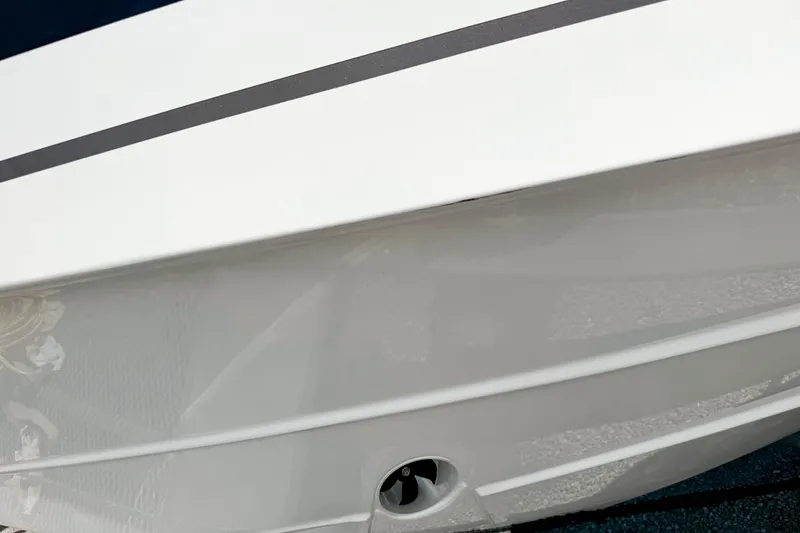 Slide: The Image of 2026 Pursuit DC 306 Dual Console boat hull with sleek design and modern finish. - 26